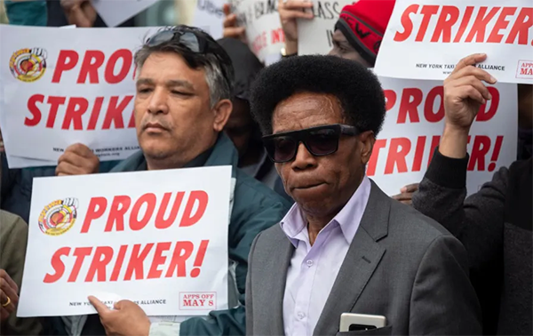 Drivers demand job security and livable incomes at a protest at Uber and Lyft’s New York City headquarters in May 2019