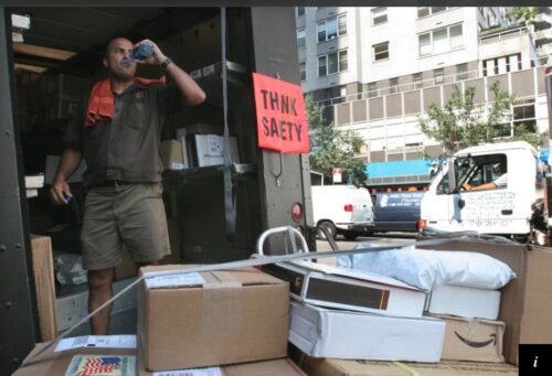 After loading up his hand truck, UPS driver Robert Garcia takes a drink of water, before heading out to deliver the packages Tuesday, Aug. 1, 2006, in New York.